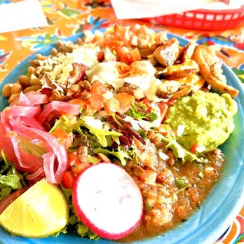 ¿Por Qué No? signature dishes Por Que PlateCarnitasCarne Asada 